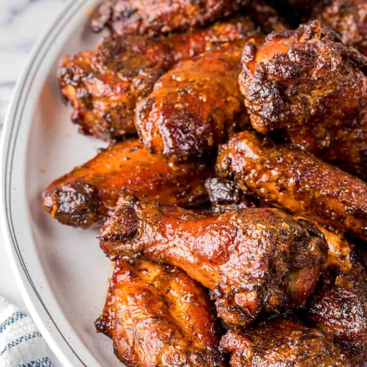 Smoked chicken wings served on a white platter