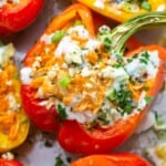 A red pepper filled with buffalo chicken, baked and topped with blue cheese and herbs.