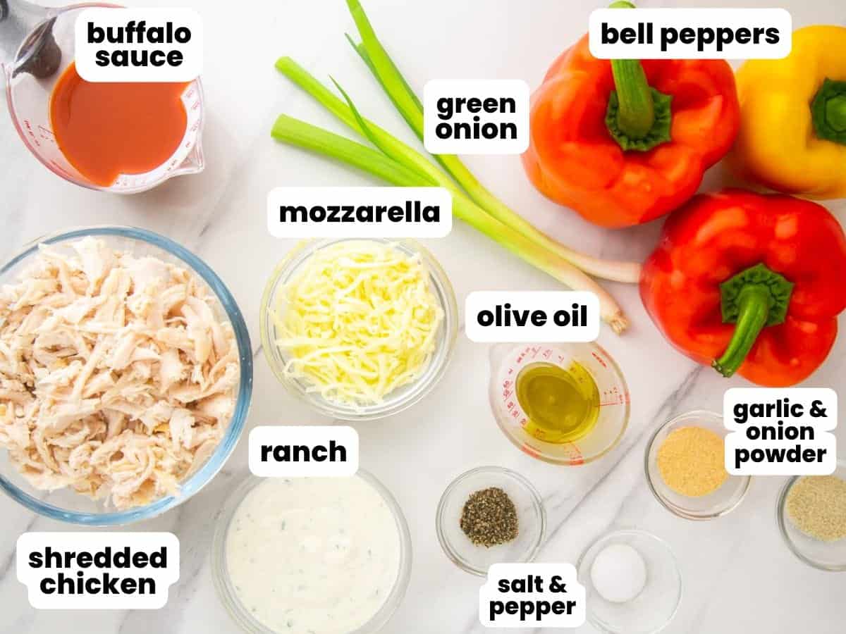The ingredients for making buffalo chicken stuffed peppers, arranged on a counter and labeled with text overlays