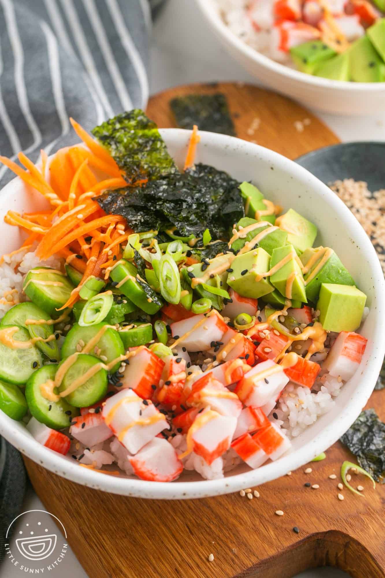 a deconstructed california sushi roll rice bowl.