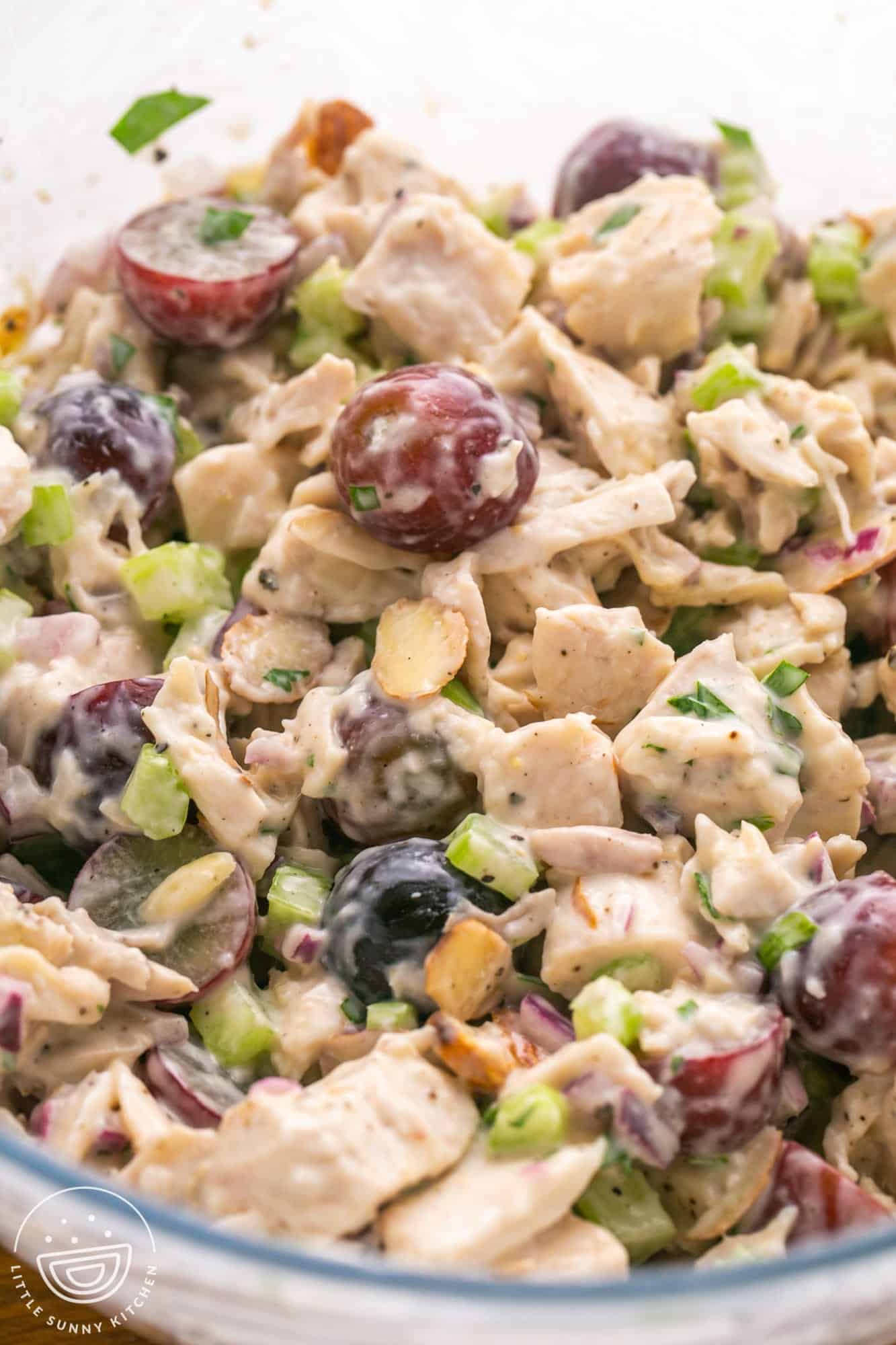 Closeup of a mixing bowl filled with freshly made chicken salad. 