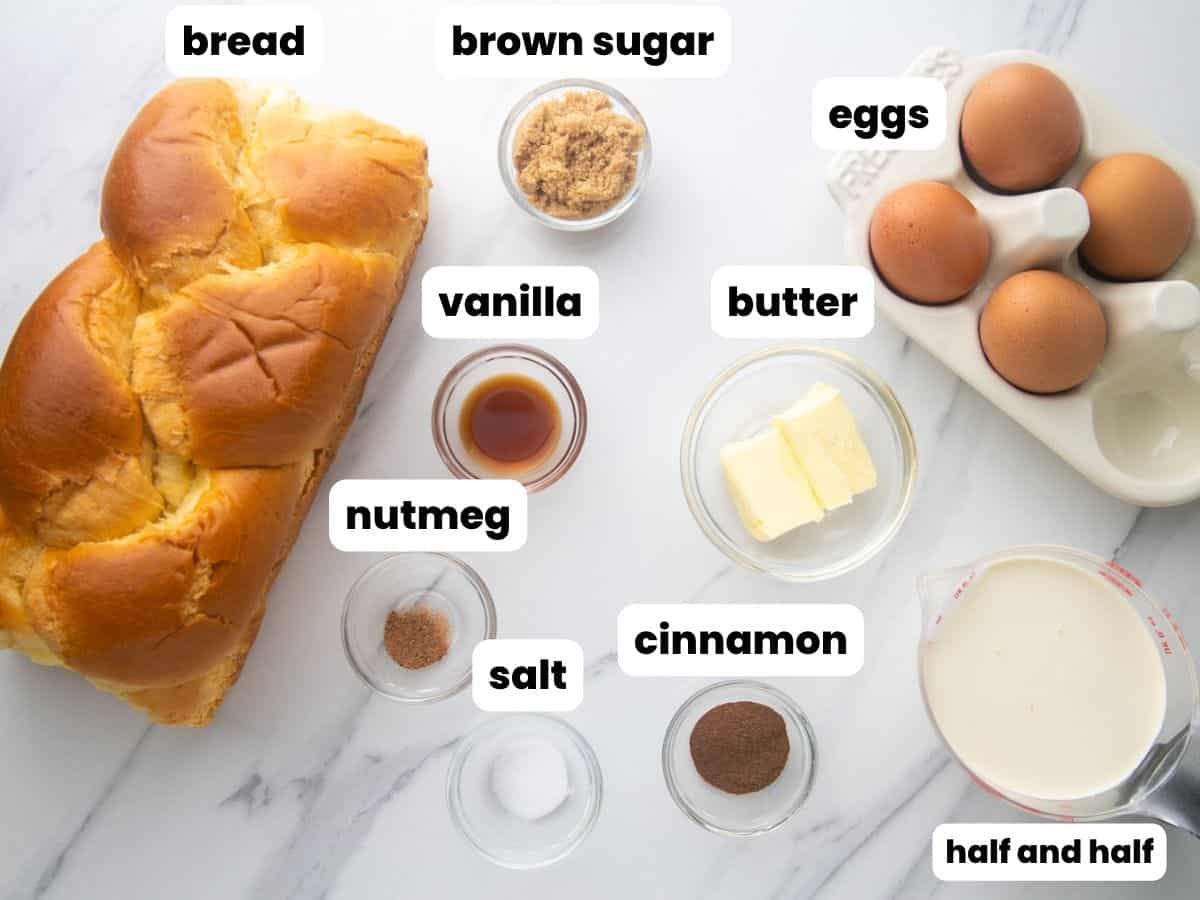 The ingredients needed to make french toast, including eggs, brioche bread, and cream.