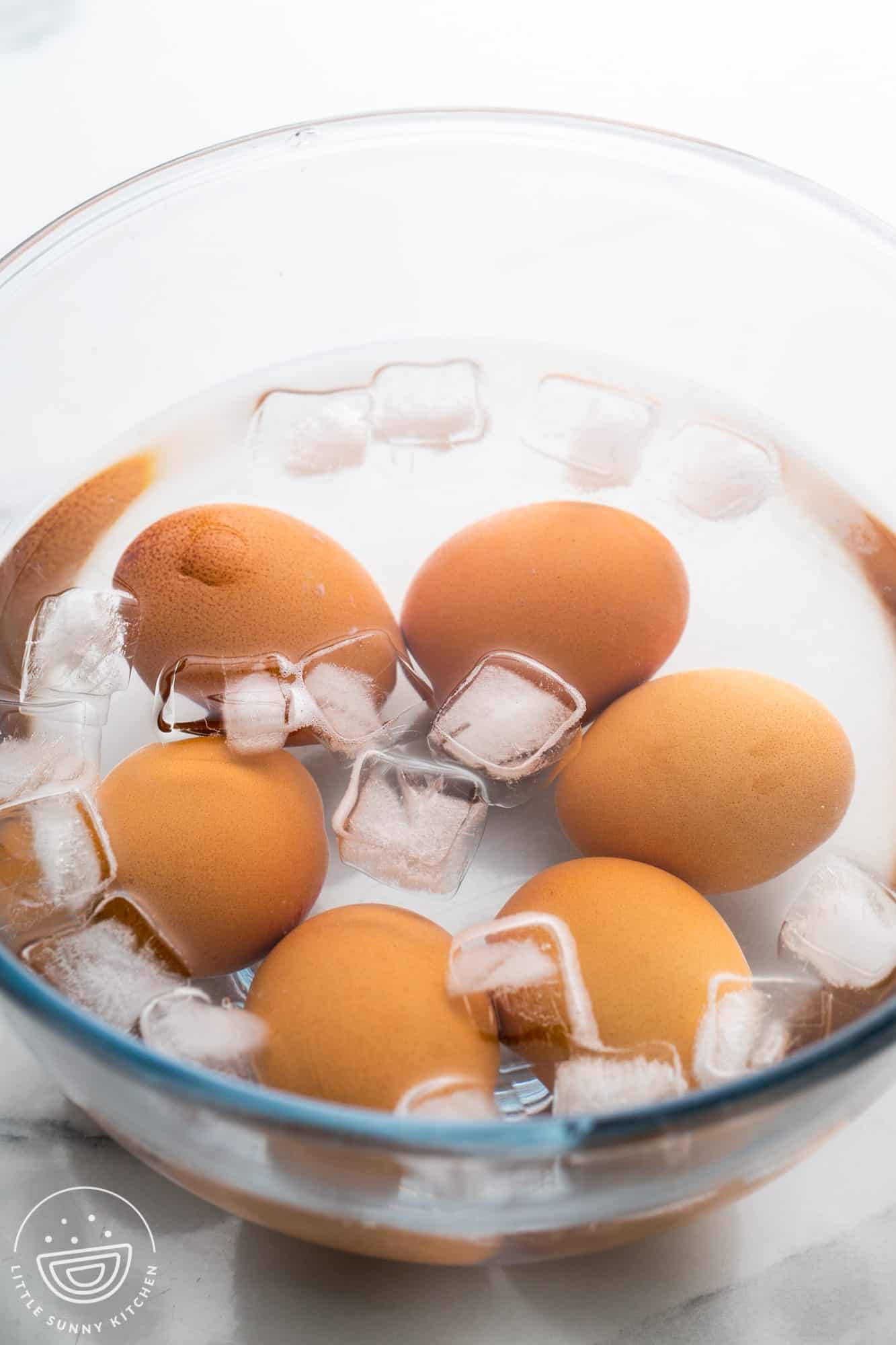 eggs in an ice bath in a glass bowl