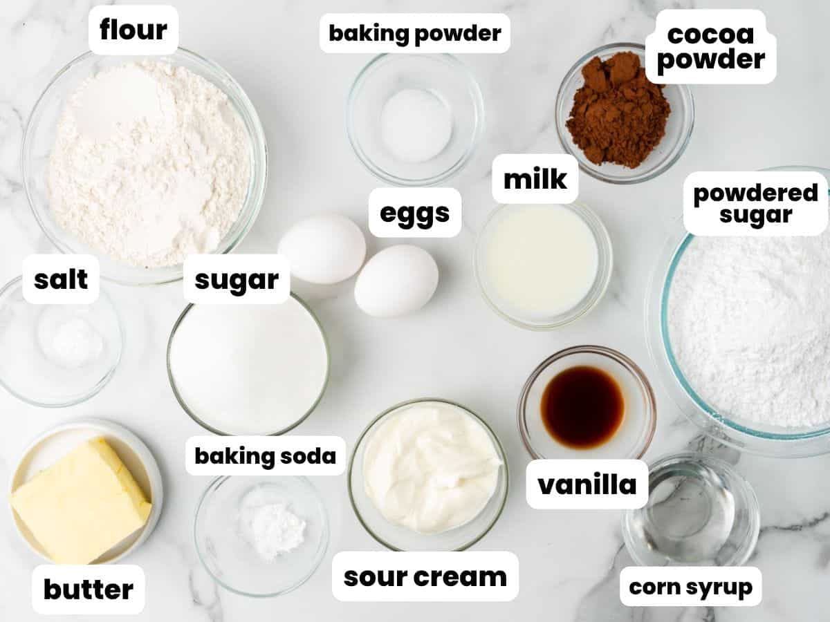 All of the ingredients for half moon cookies, measured into separate bowls and arranged on a counter.