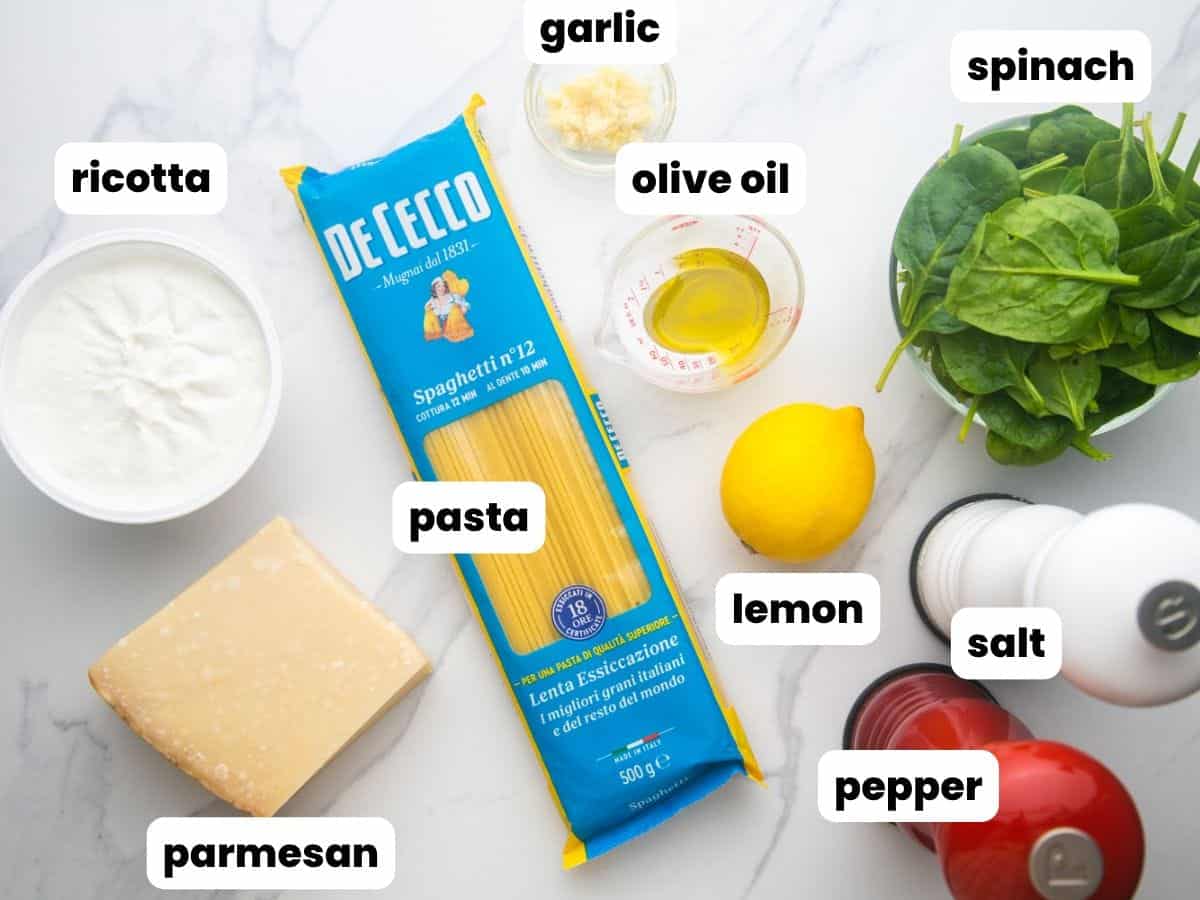 The ingredients needed to make ricotta pasta, all on the counter, and labeled with text boxes.