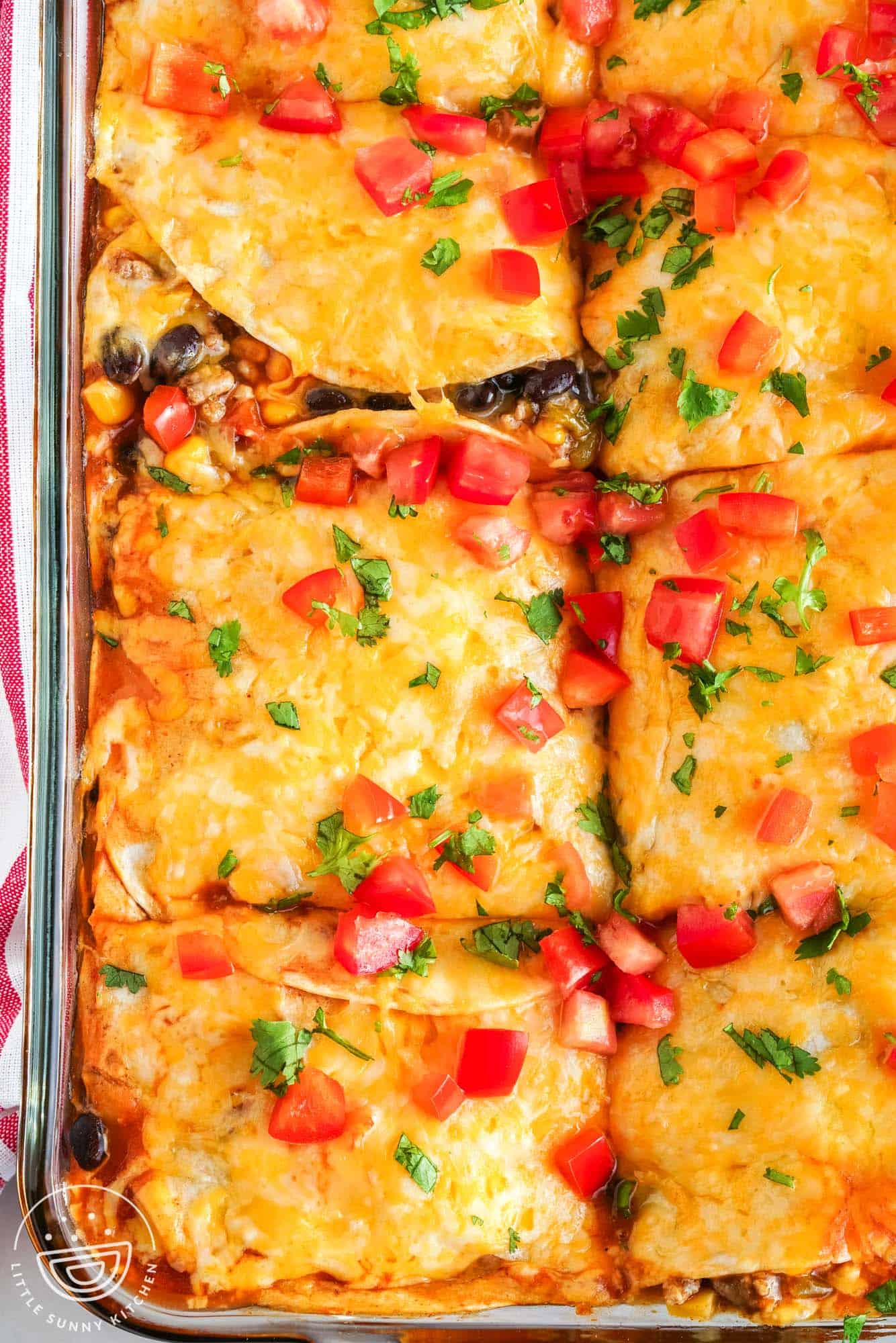 beef enchilada casserole in a baking pan, sliced into squares.