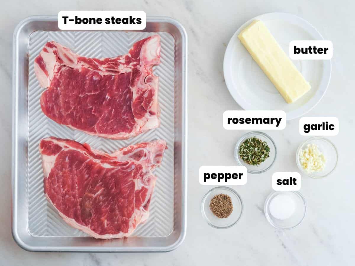 a tray of two t-bone steaks next to a stick of butter and seasonings. Each ingredient is labeled with a text overlay.
