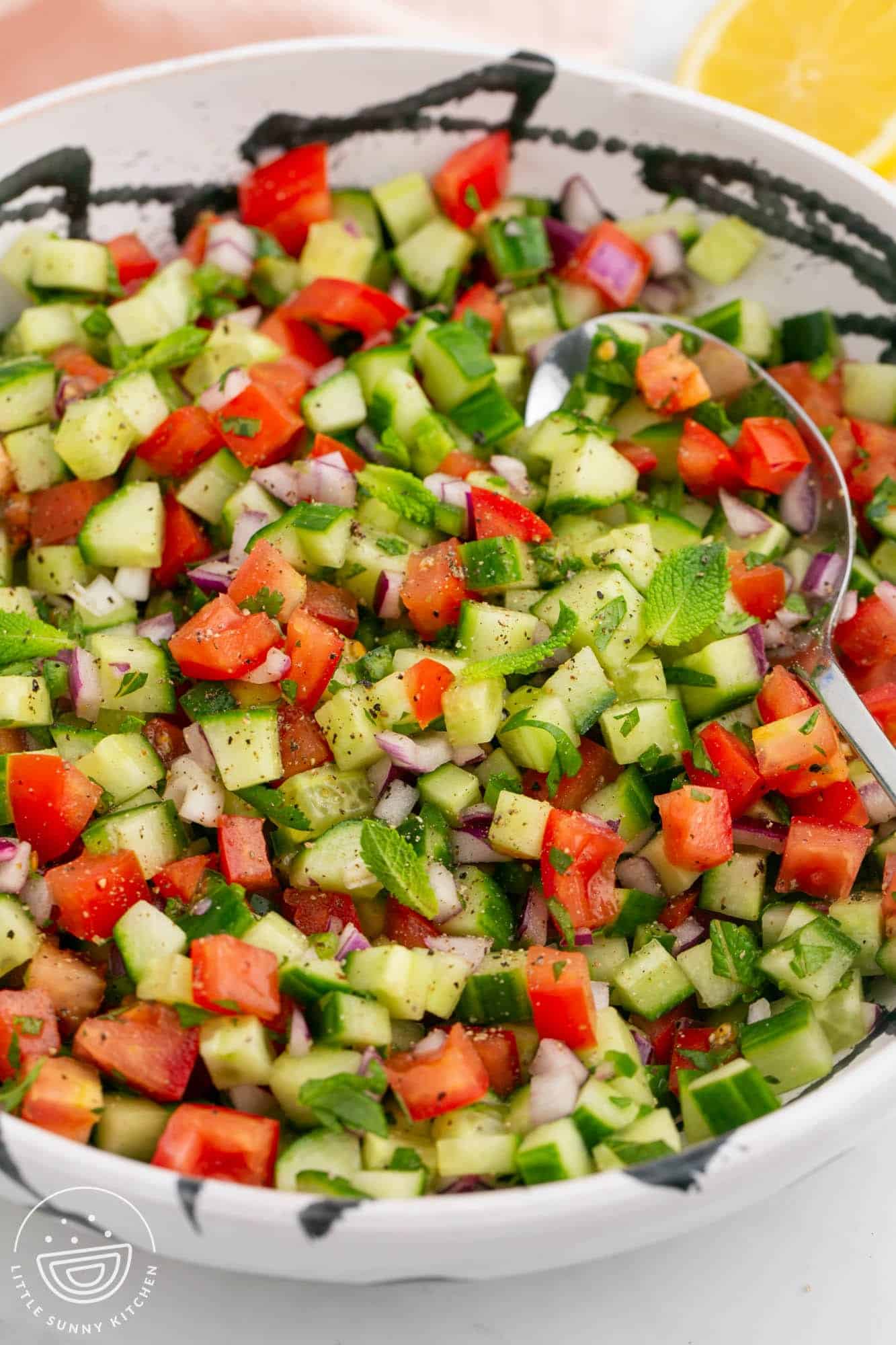 Chopped Indian salad in a large white bowl