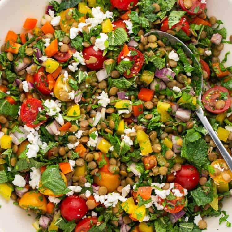 lentil salad with tomatoes, feta, herbs, in a bowl