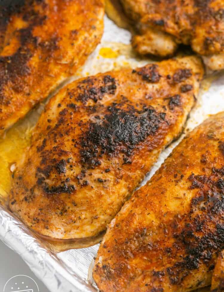 Blackened Chicken on a sheet pan lined with foil
