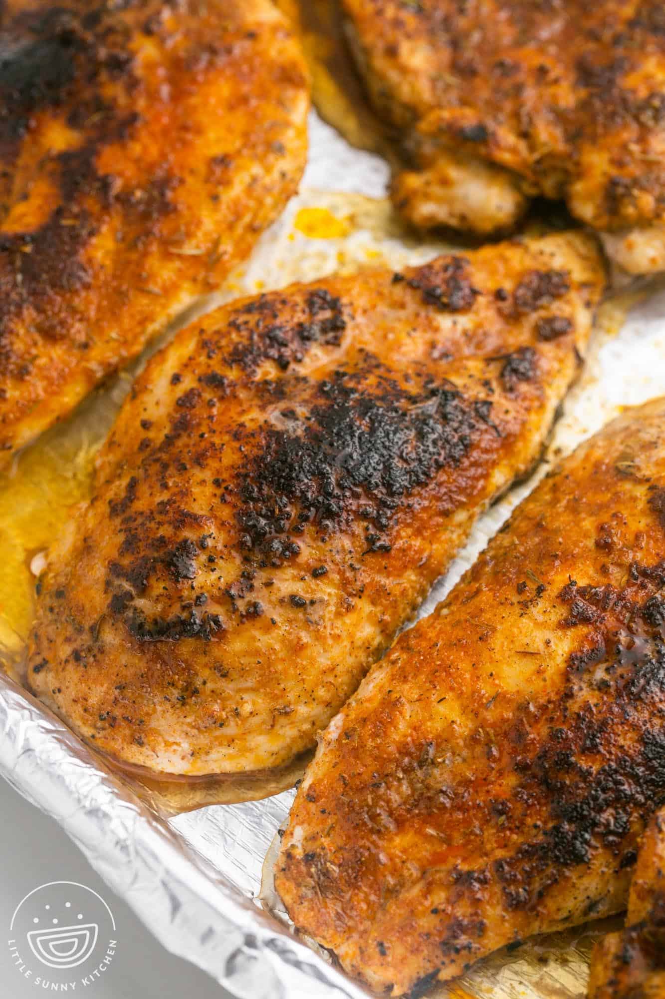 Blackened Chicken on a sheet pan lined with foil