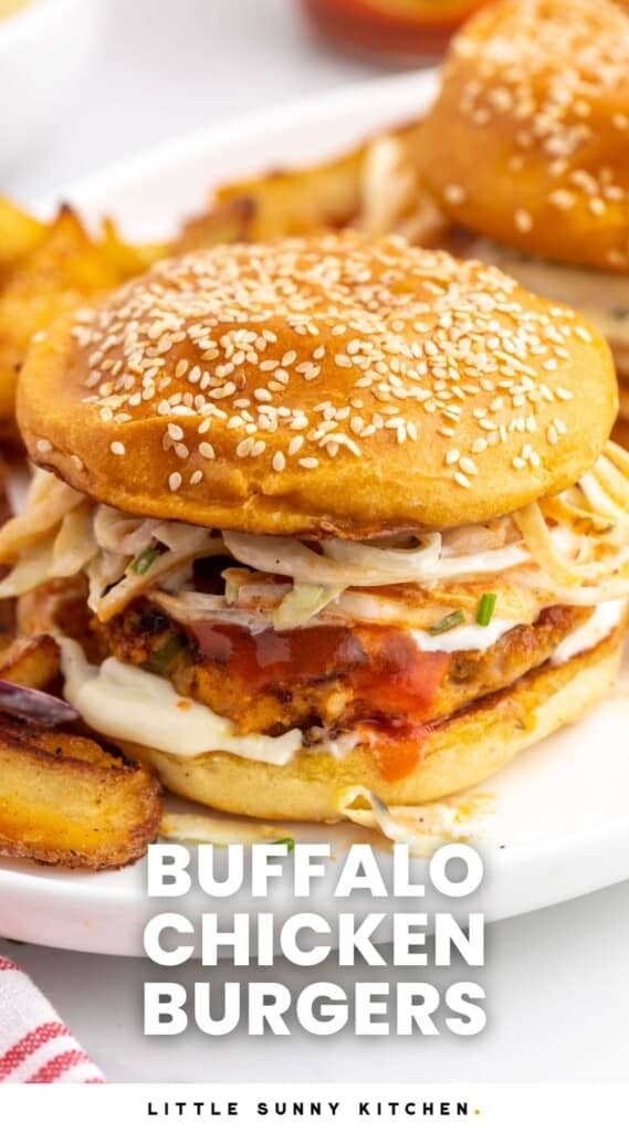 a seeded bun holding a buffalo chicken burger with creamy slaw. Text at bottom of image says "buffalo chicken burger"