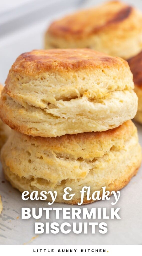 two buttermilk biscuits, stacked. Text overlay says "easy and flaky buttermilk biscuits"