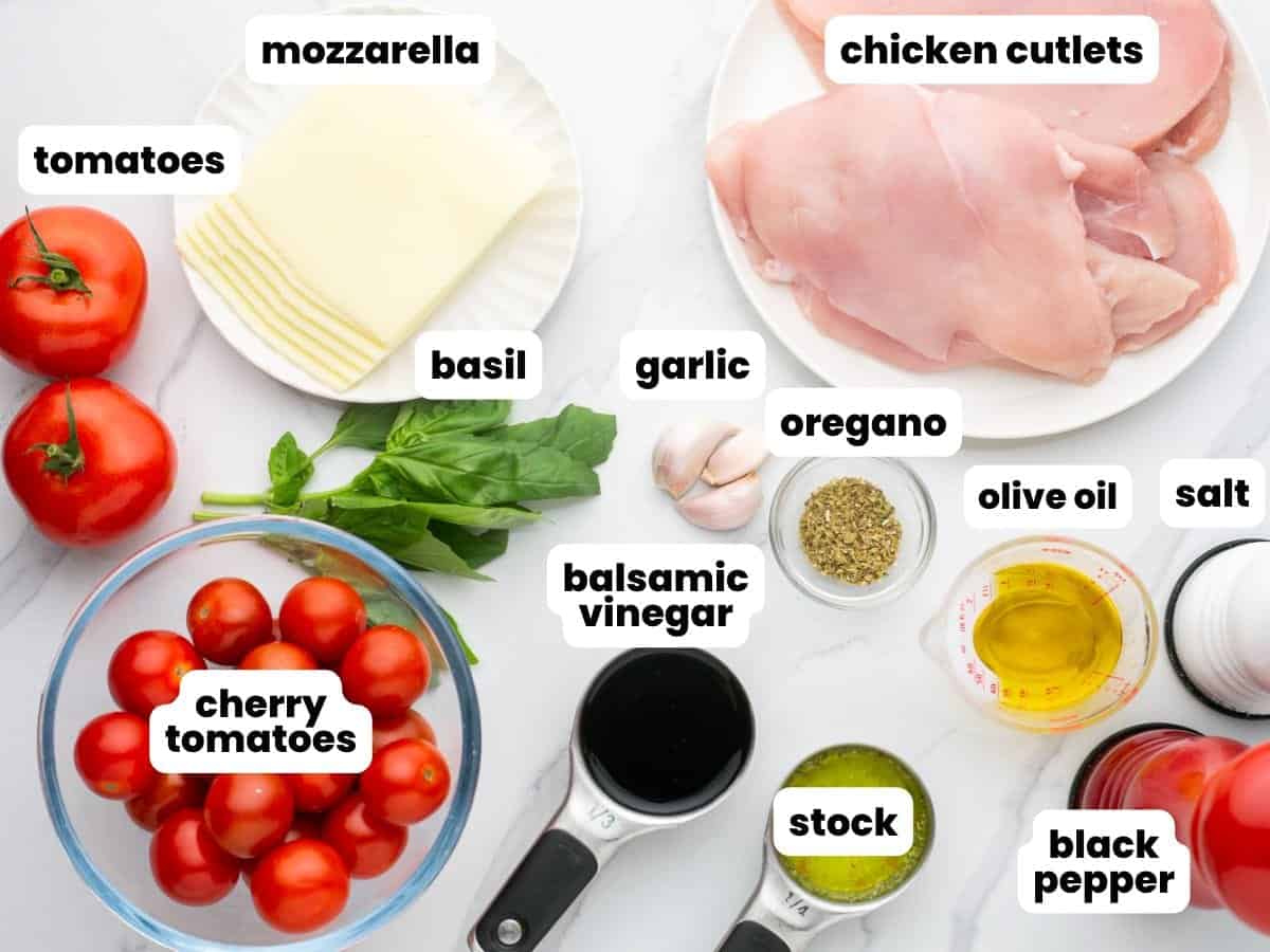 The ingredients needed to make skillet chicken caprese, arranged on a counter.
