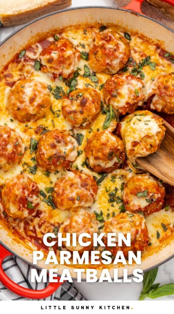 a skillet of chicken meatballs in tomato sauce, topped with mozzarella cheese. Text overlay says "chicken parmesan meatballs"
