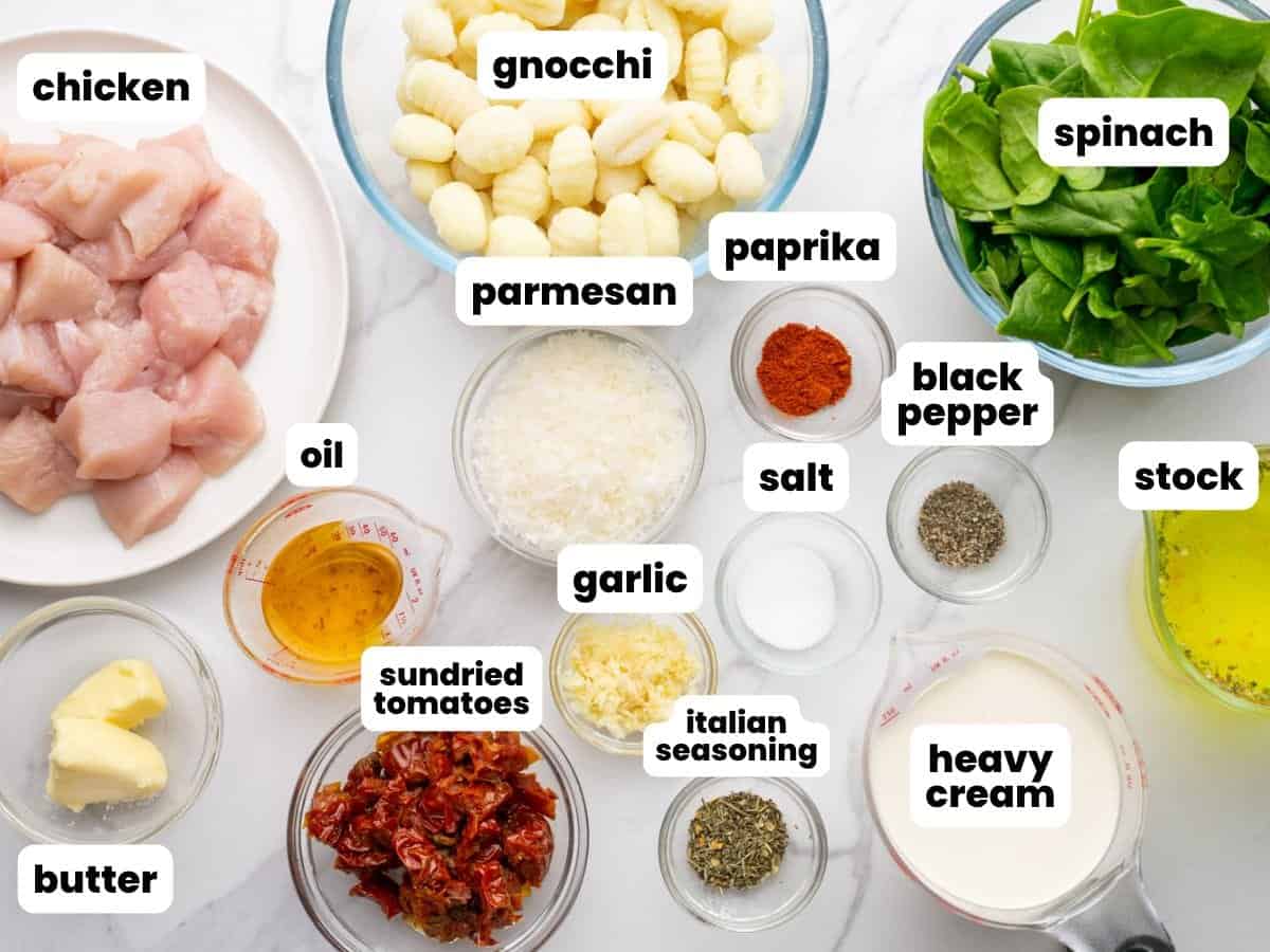 The ingredients needed to make gnocchi with chicken, spinach, and sundried tomatoes.