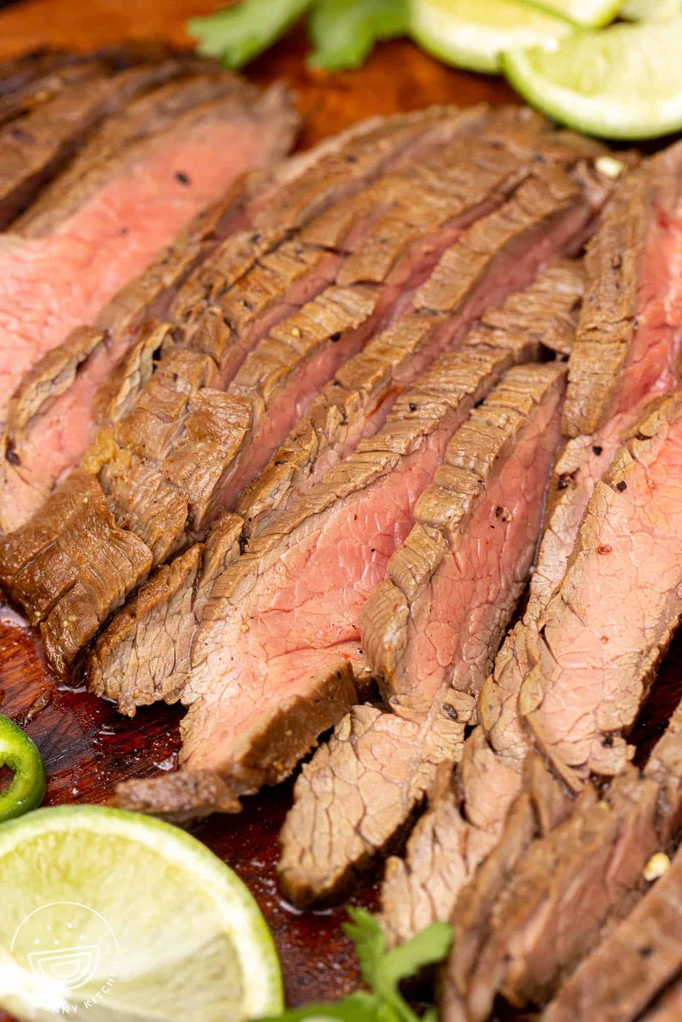 closeup view of grilled and sliced carne asada steak, it's done medium well.