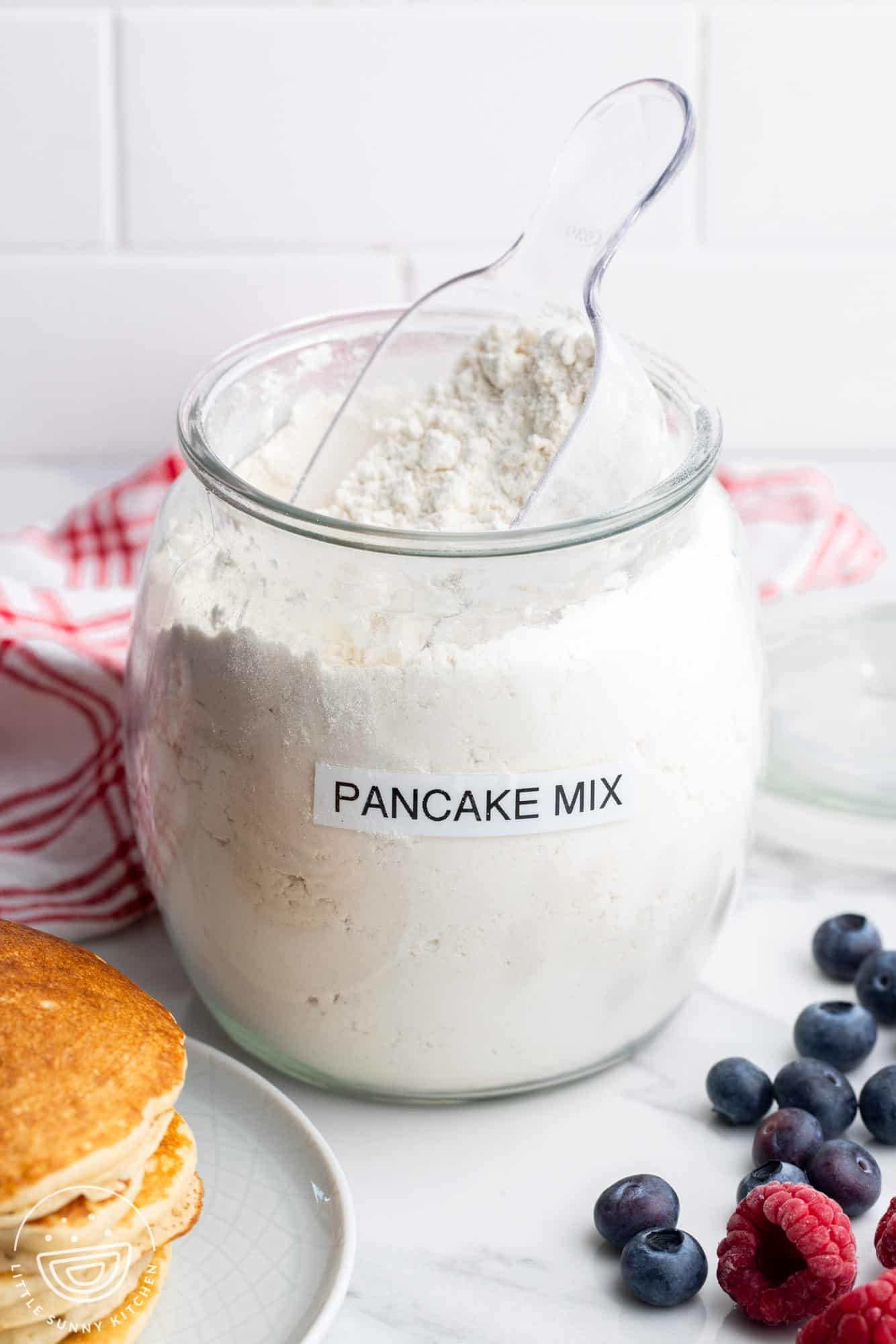 a large glass jar labeled "pancake mix". 