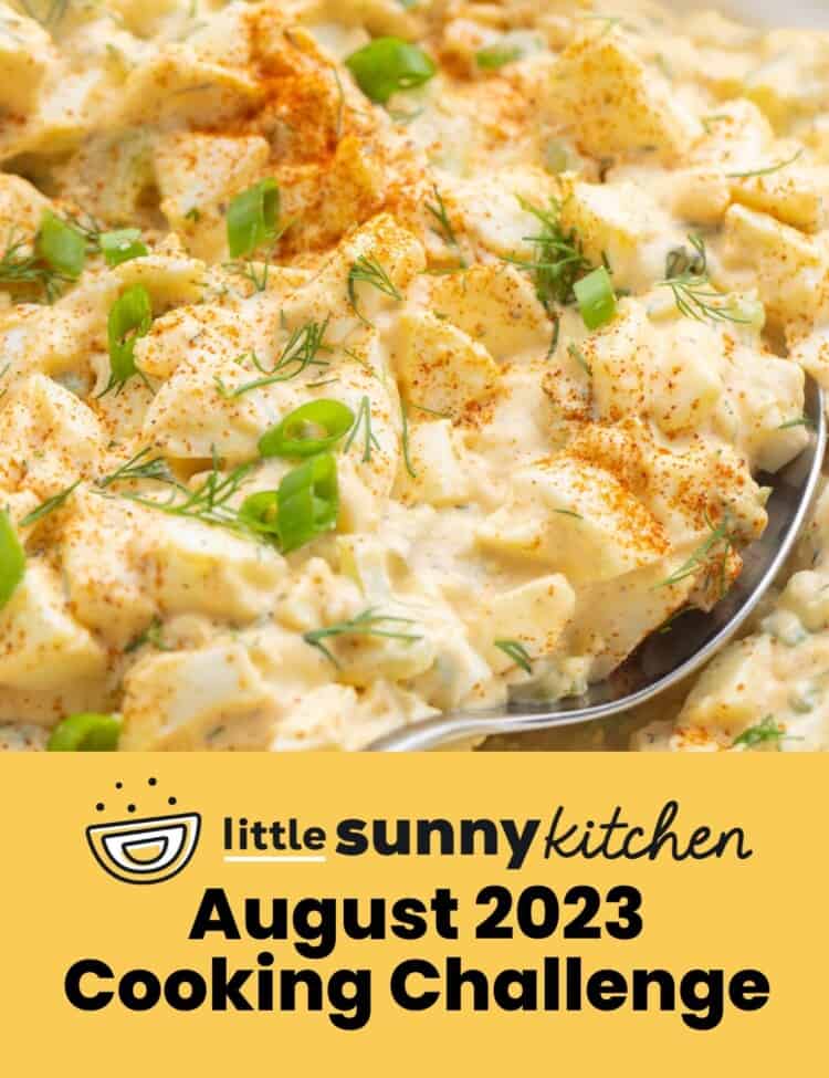 Egg salad with a spoon, and an overlay text that says "August 2023 Cooking Challenge"