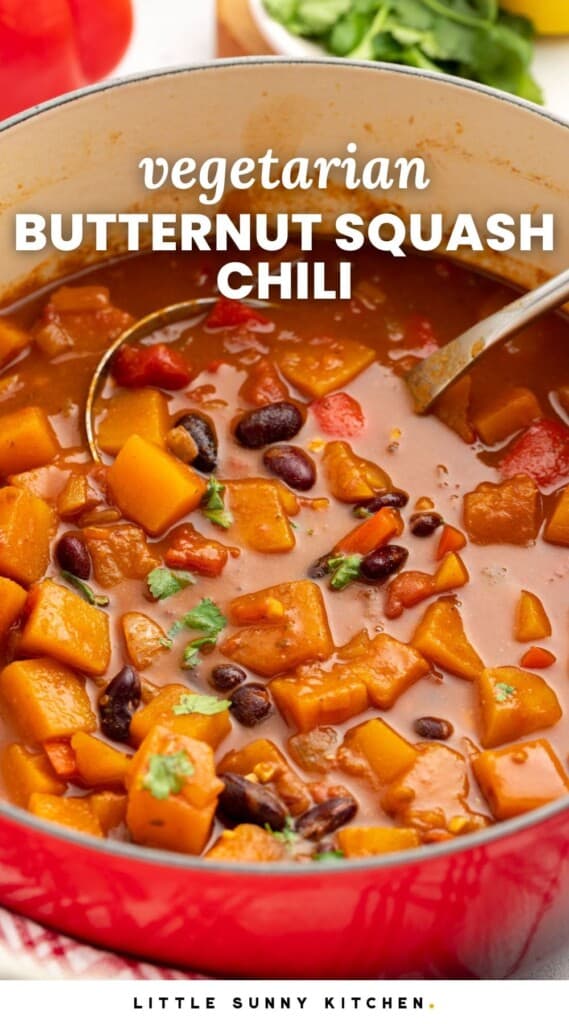 vegetarian chili with squash in a red dutch oven. Text overlay says "vegetarian butternut squash chili"