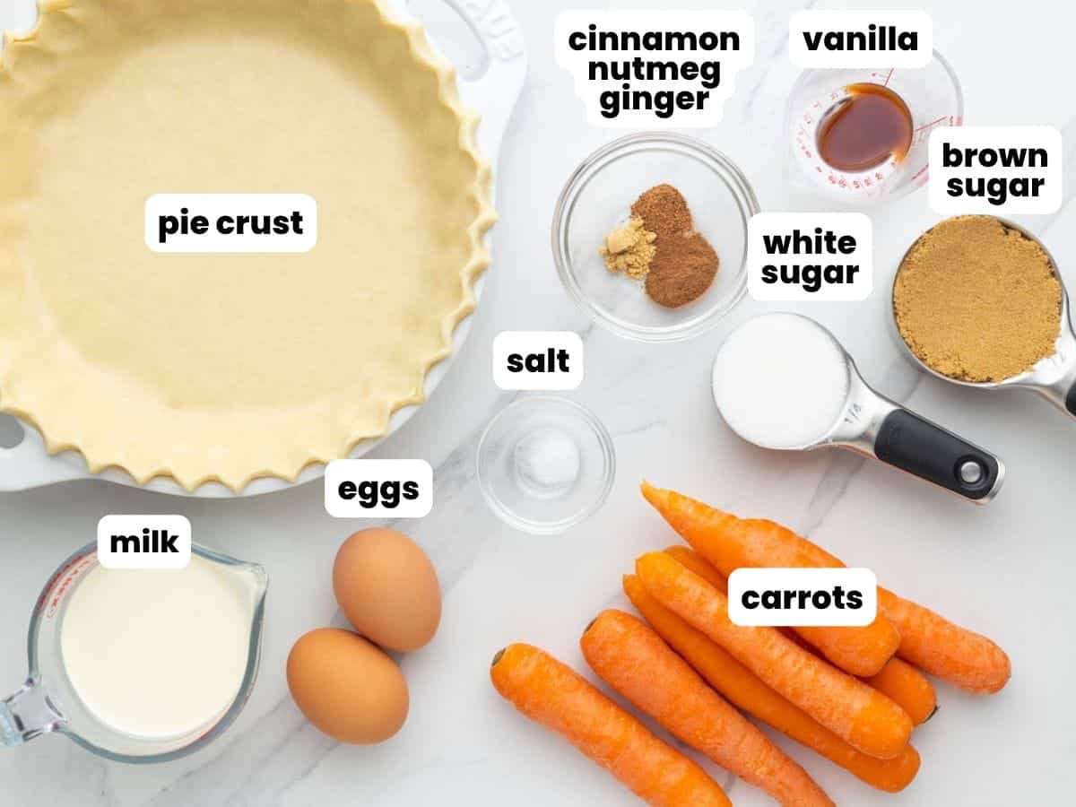 The ingredients needed to make homemade carrot pie, including carrots, pie crust, and sugar.