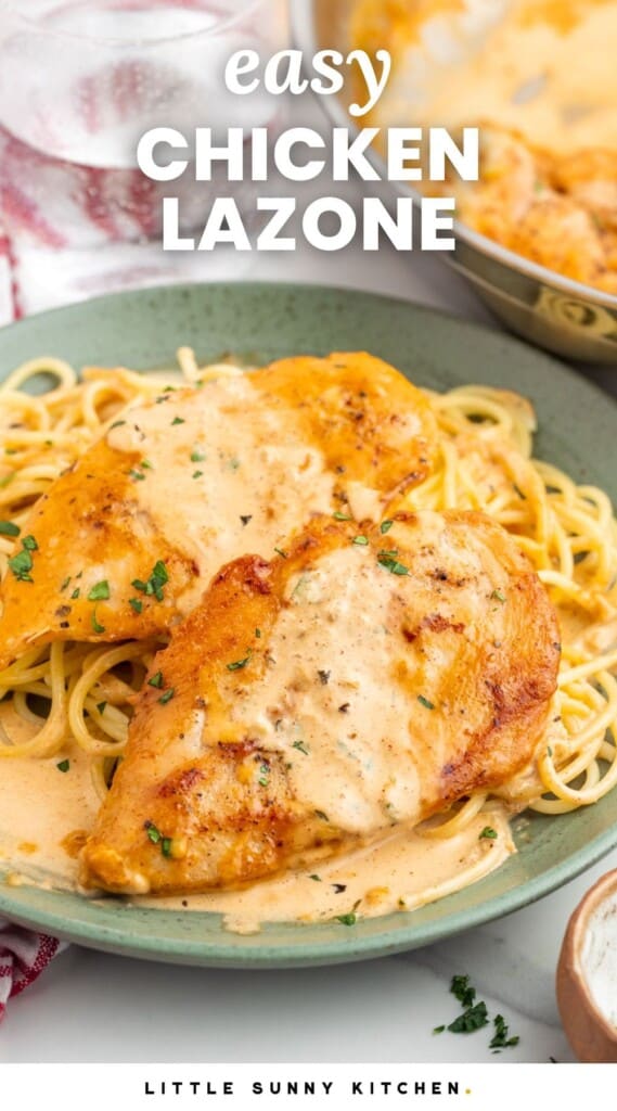 Seared chicken cutlets with sauce over spaghetti. Text overlay says "easy chicken lazone"
