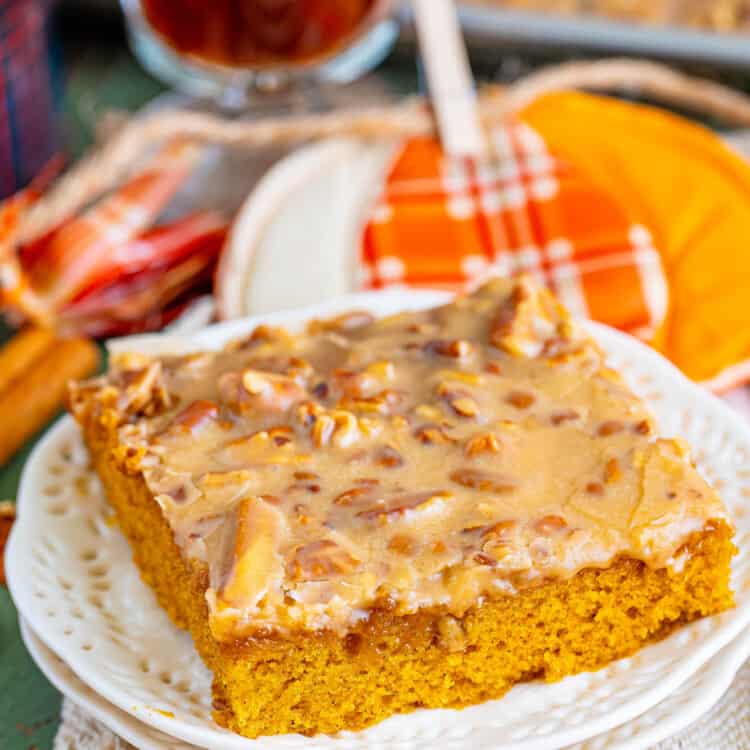 a square of pumpkin sheet cake with praline frosting on a plate.