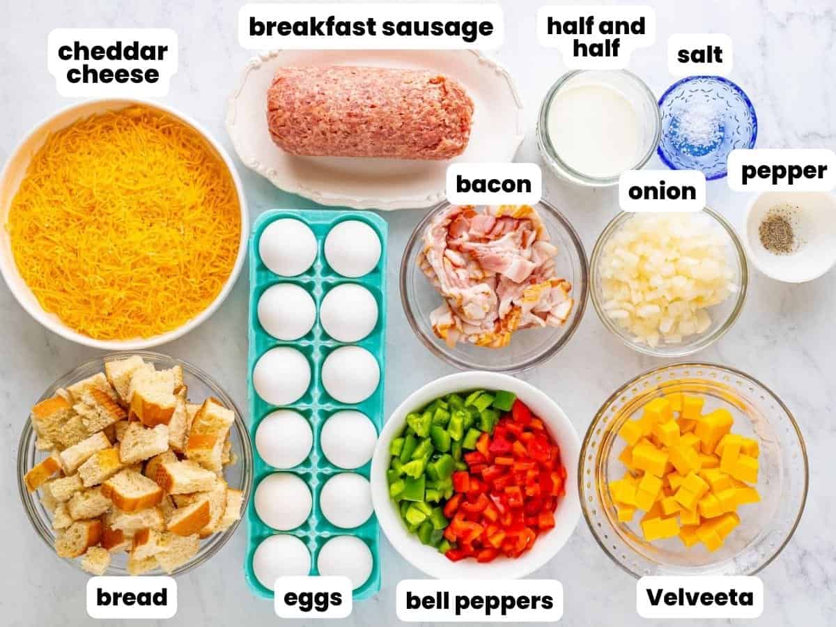 The ingredients needed to make breakfast casserole, including, eggs, sausage, bacon, and cheese