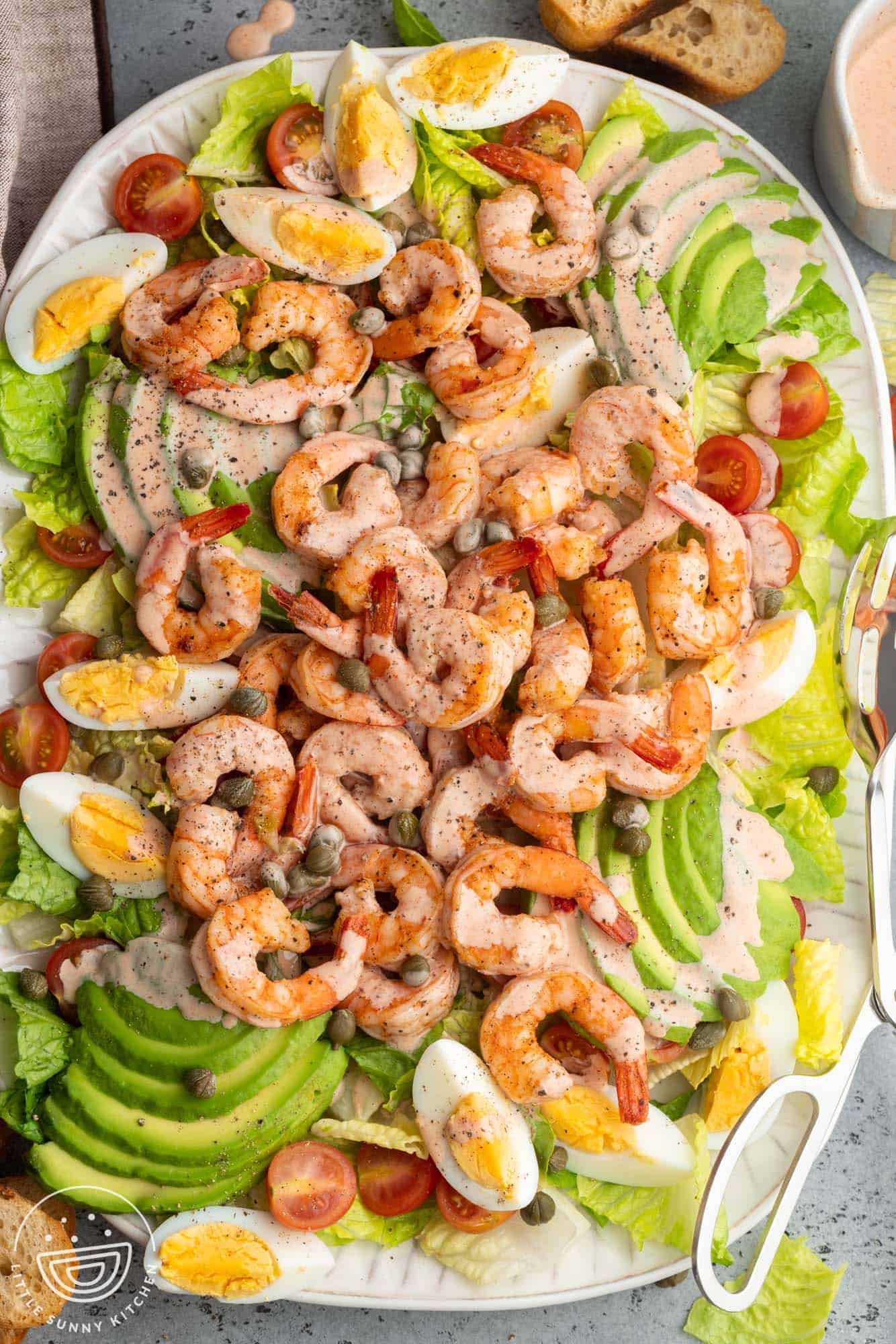a large shrimp louie salad, viewed from overhead