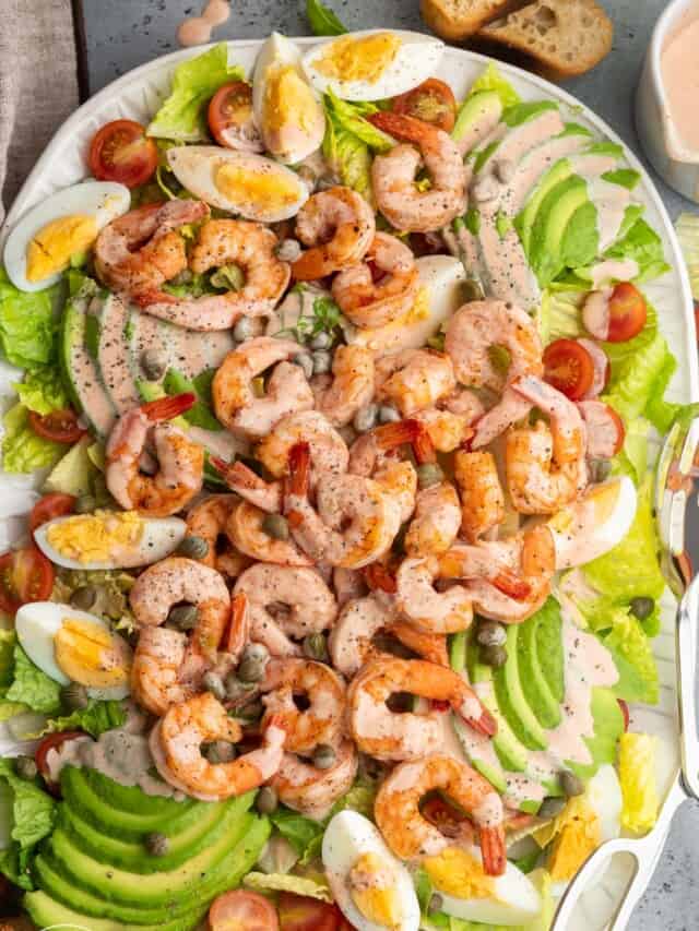 a large shrimp louie salad, viewed from overhead