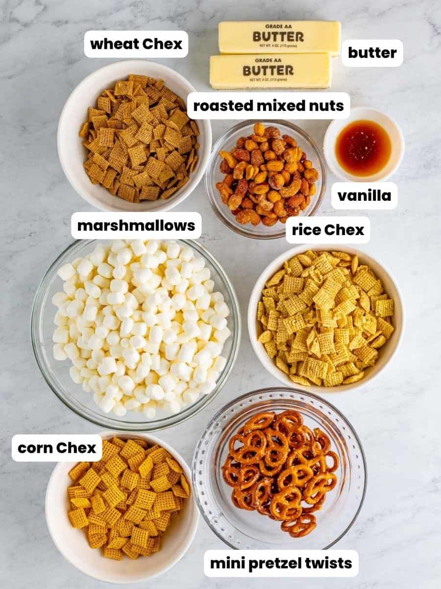 The ingredients in sweet chex mix marshmallow treats, all in separate bowls, labeled with text boxes.