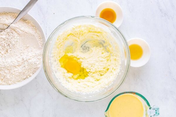 Adding an egg and extracts to the mixture