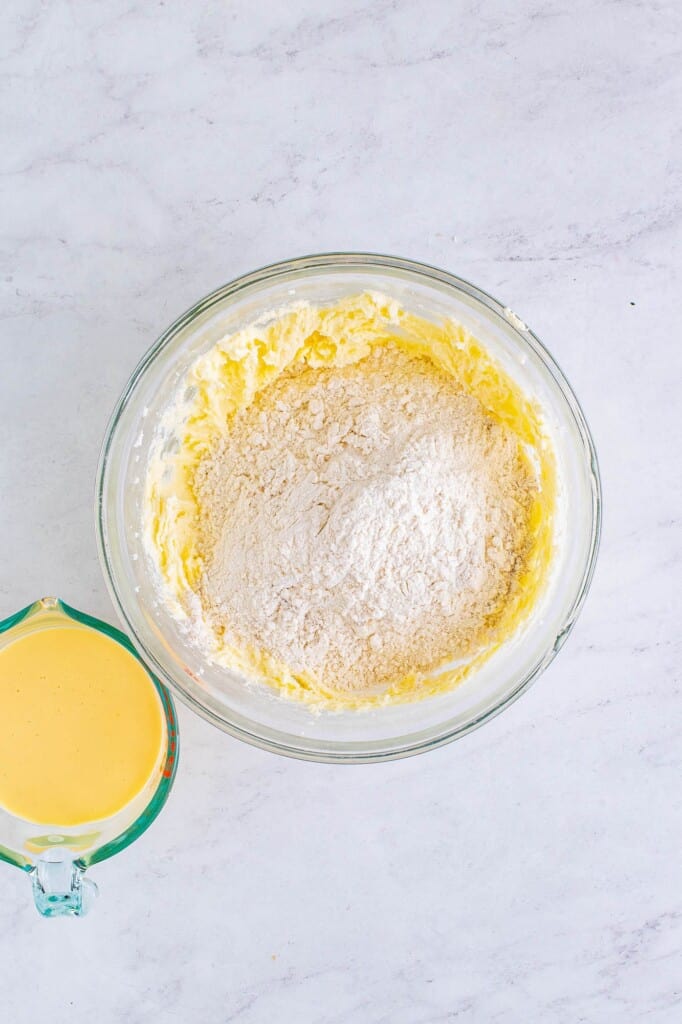 Adding dry ingredients to creamed butter and sugar