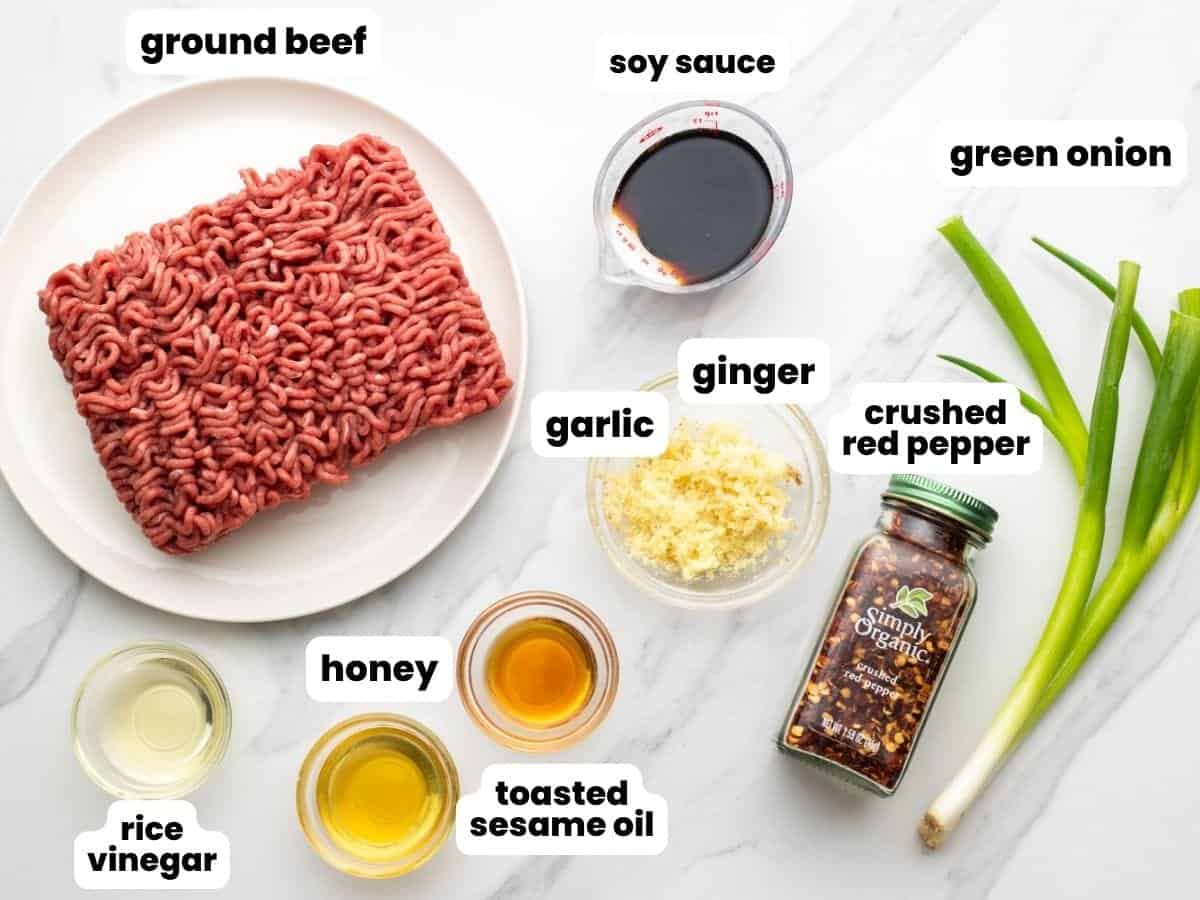 The ingredients needed to make Korean ground beef, including garlic, ginger, crushed red pepper, and soy sauce.