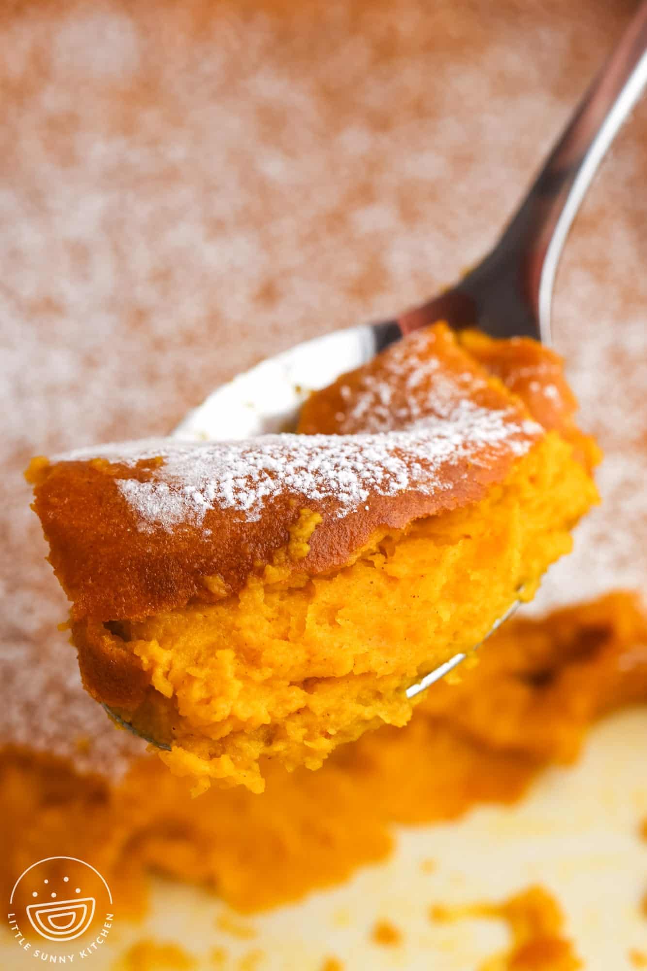 A spoonful of carrot souffle being served