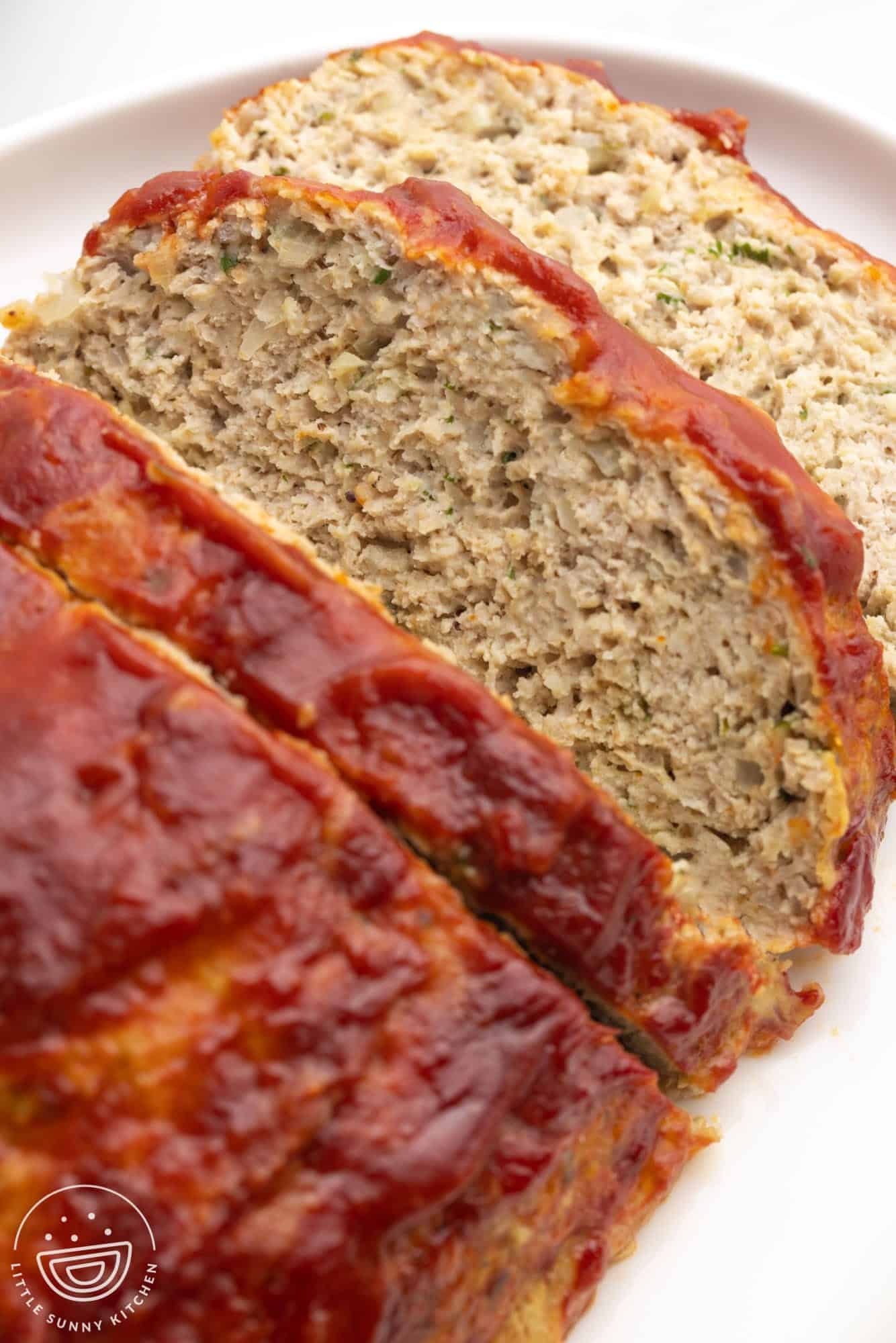 closeup of a slice of moist chicken meatloaf
