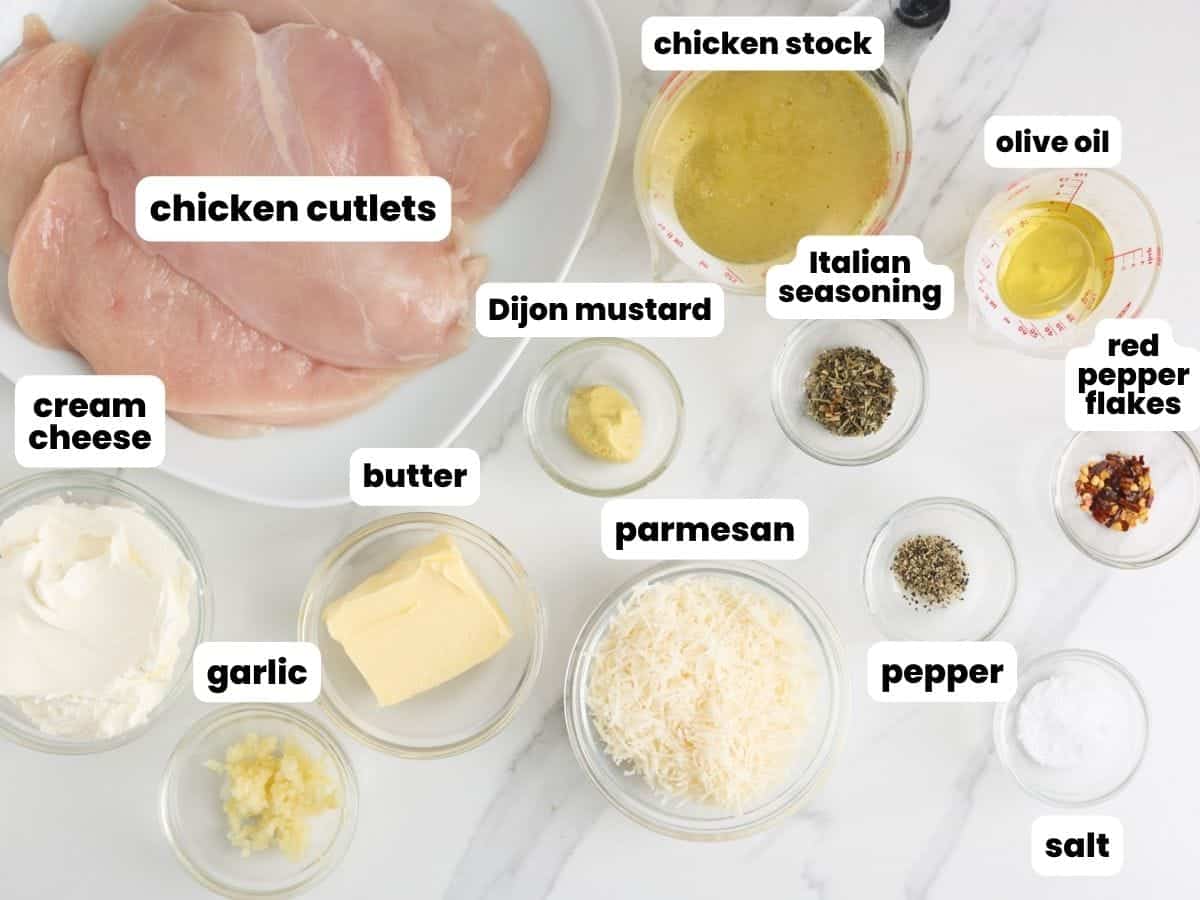 The ingredients needed to make chicken with cream cheese alfredo sauce