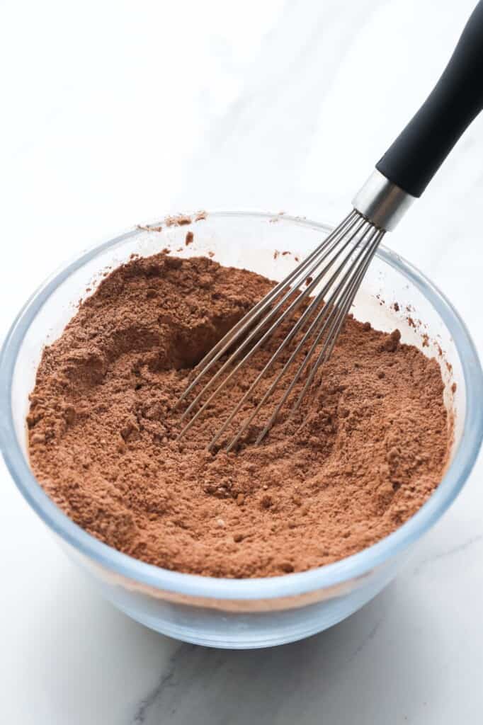 cocoa powder whisked in a small bowl