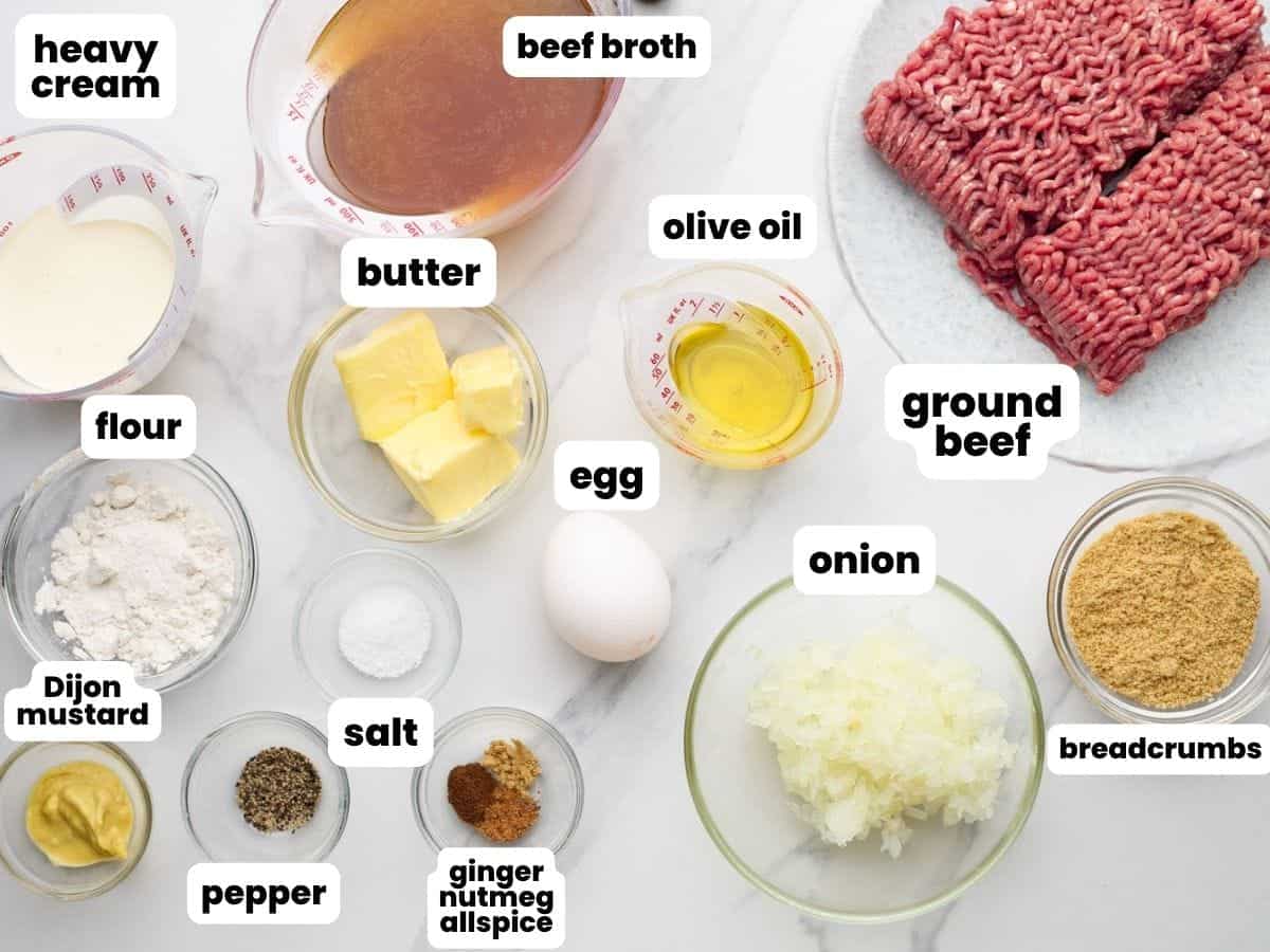 Ikea meatballs ingredients measured into small bowls and arranged on a counter.