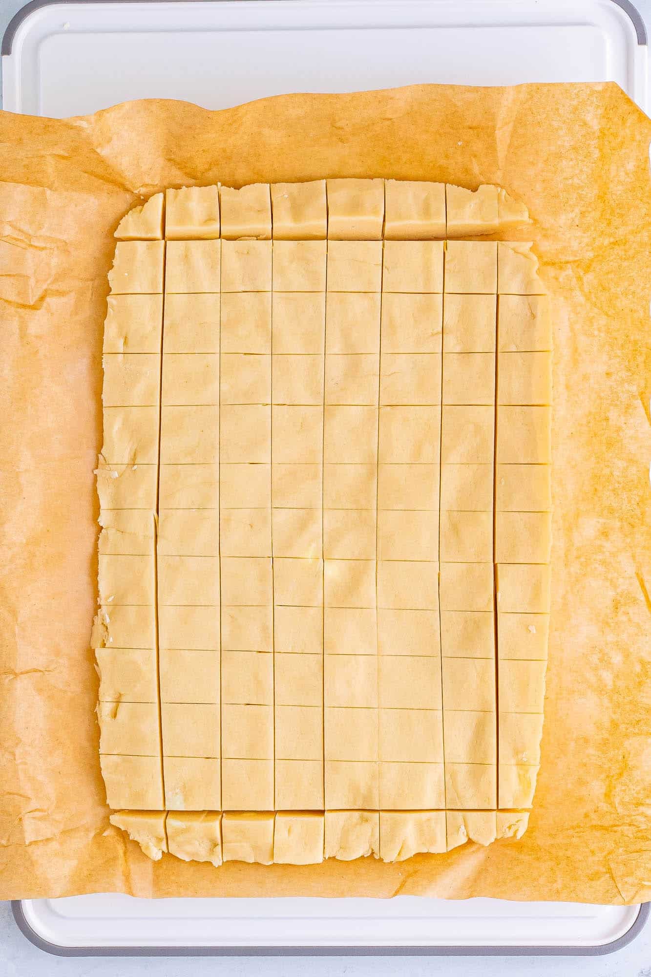 chilled shortbread dough cut into squares.