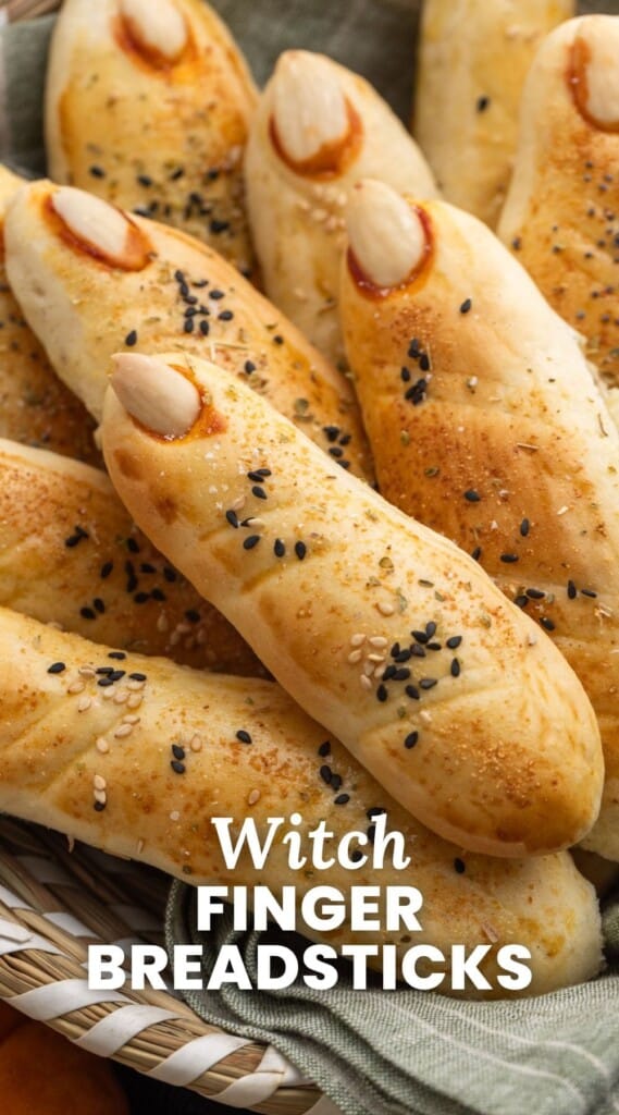 Witches finger breadsticks in a bread basket, and overlay text that says "witch finger breadsticks"