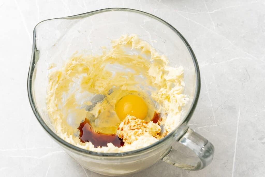 creamed butter, egg and vanilla extract in a glass mixing bowl.