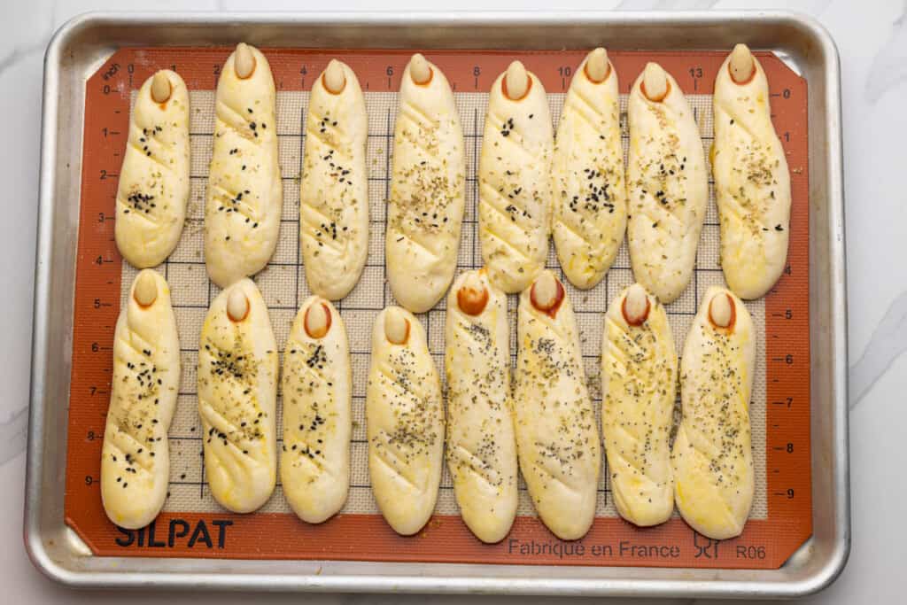 Witch finger breadsticks on a sheet pan before baking
