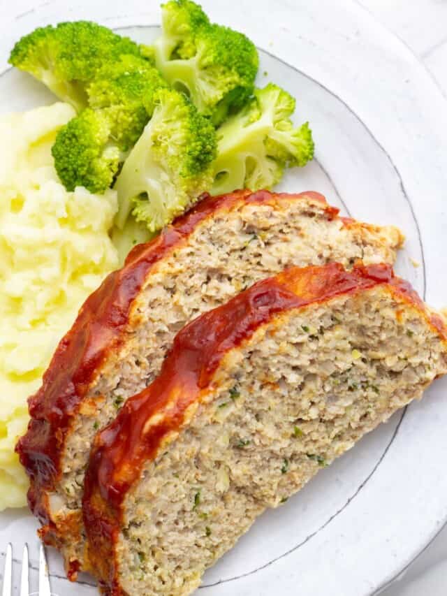 a dinner plate of two slices of chicken meatloaf with potatoes and broccoli.