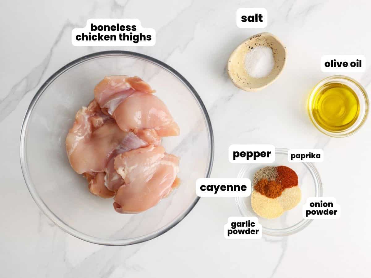 The ingredients needed to make flavorful baked boneless chicken thighs.
