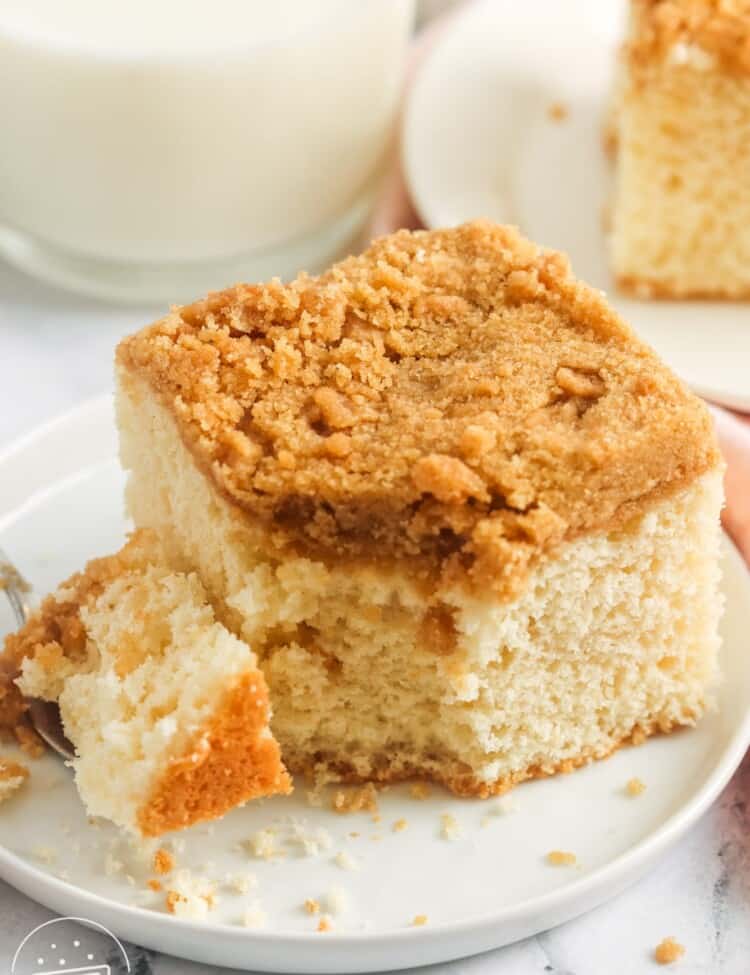 a serving of coffee cake with a bite taken.