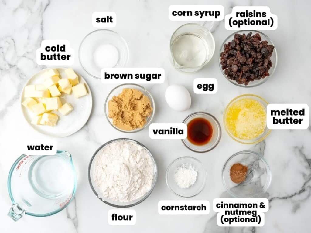 The ingredients needed to make classic Canadian butter tarts including optional raisins, optional spices.
