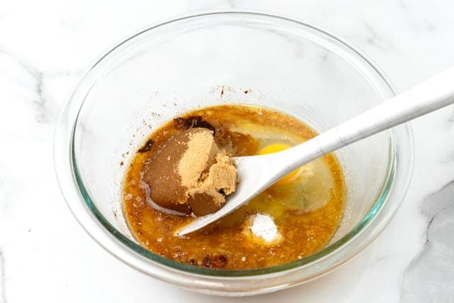 butter, eggs, brown sugar mixed in a bowl.