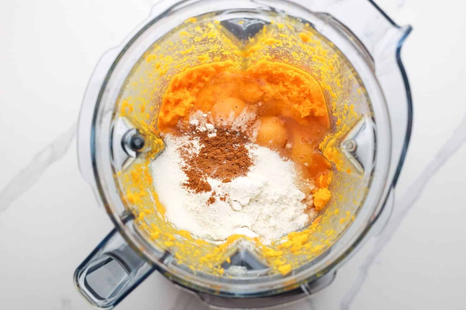 Carrot souffle ingredients in a blender jug before mixing