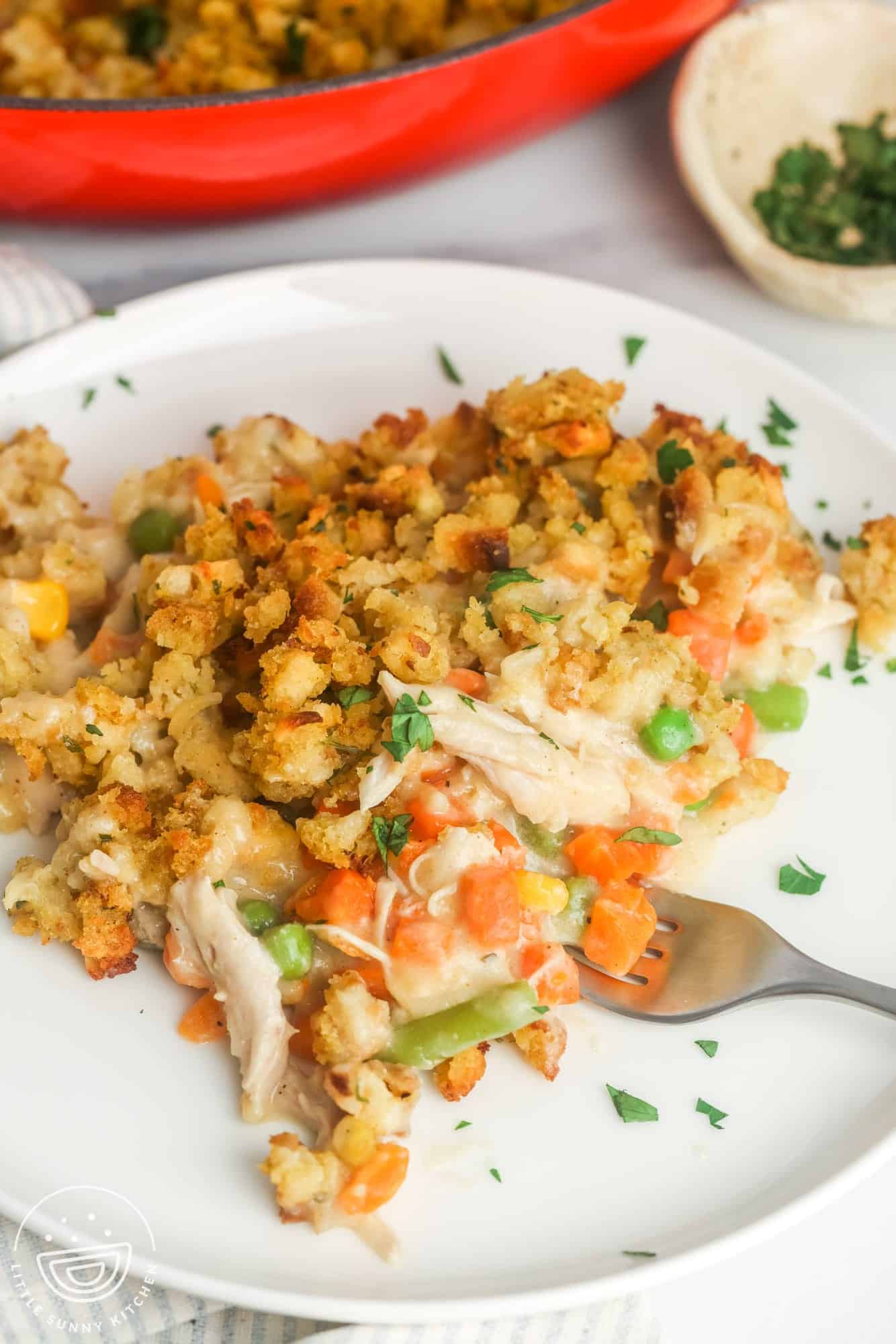 a serving of easy chicken stuffing casserole with vegetables.